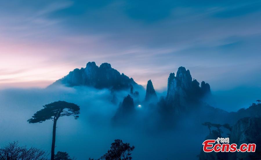Clouds surround Mount Sanqing in Jiangxi Province. Mount Sanqing National Park is a UNESCO world heritage site, known for its exceptional scenic quality, marked by a concentration of fantastically shaped pillars and peaks. (Photo: China News Service/Zheng Xiaiping)