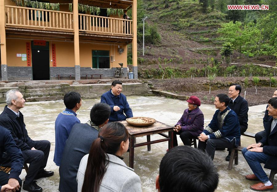 Chinese President Xi Jinping, also general secretary of the Communist Party of China Central Committee and chairman of the Central Military Commission, talks with villagers to learn about the progress of poverty alleviation and in solving prominent problems including meeting the basic need of food and clothing and guaranteeing compulsory education, basic medical care and safe housing, in Huaxi Village of Shizhu Tujia Autonomous County, southwest China\'s Chongqing, April 15, 2019. Xi went on an inspection tour in southwest China\'s Chongqing Municipality Monday. (Xinhua/Xie Huanchi)