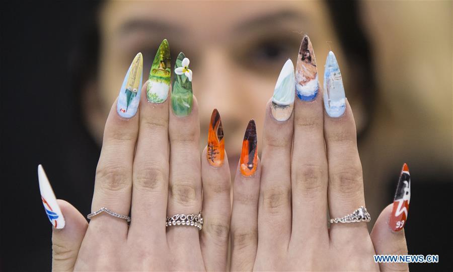 A model displays her nail fashion during the Nail Art Challenge at the 2019 Revel in Beauty event in Toronto, Canada, on April 15, 2019. The Nail Art Challenge was held on Monday to showcase the creative process of nail art to spectators. (Xinhua/Zou Zheng)
