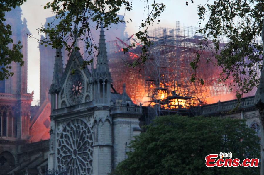 The Notre Dame Cathedral is on fire in central Paris, capital of France, on April 15, 2019. A blaze broke out on Monday afternoon at the Notre Dame Cathedral in central Paris. (Photo/China News Service)