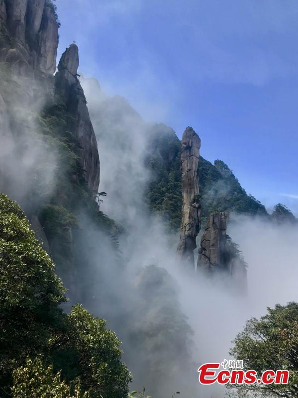 Clouds surround Mount Sanqing in Jiangxi Province. Mount Sanqing National Park is a UNESCO world heritage site, known for its exceptional scenic quality, marked by a concentration of fantastically shaped pillars and peaks. (Photo: China News Service/Lin Min)