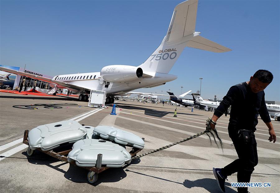 A staff member works to prepare for the upcoming 2019 Asian Business Aviation Conference & Exhibition at Shanghai Hongqiao International Airport in east China\'s Shanghai, April 15, 2019. The 2019 Asian Business Aviation Conference & Exhibition (ABACE) will be held from April 16 to 18 at a business aviation service center of Shanghai Hongqiao International Airport. The event is participated by about 150 global exhibitors showcasing more than 30 aircrafts. (Xinhua/Chen Fei)