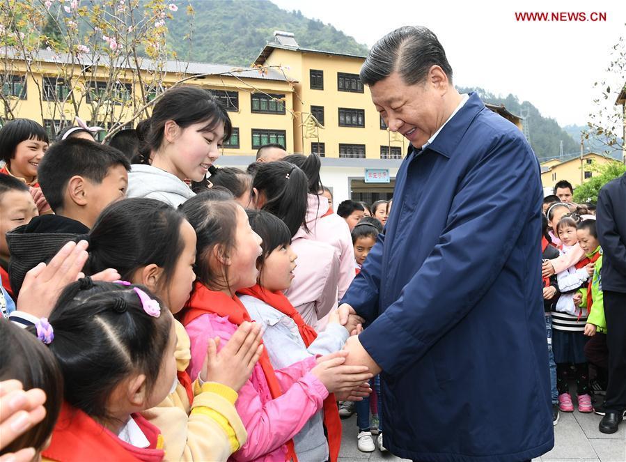 Chinese President Xi Jinping, also general secretary of the Communist Party of China Central Committee and chairman of the Central Military Commission, talks with students at a primary school in Zhongyi Township of Shizhu Tujia Autonomous County, southwest China\'s Chongqing, April 15, 2019. Xi went on an inspection tour in southwest China\'s Chongqing Municipality Monday. (Xinhua/Xie Huanchi)