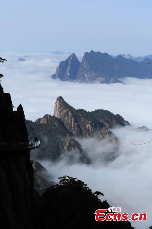 Clouds surround Mount Sanqing in Jiangxi Province. Mount Sanqing National Park is a UNESCO world heritage site, known for its exceptional scenic quality, marked by a concentration of fantastically shaped pillars and peaks. (Photo: China News Service/Zhang Hezhong)