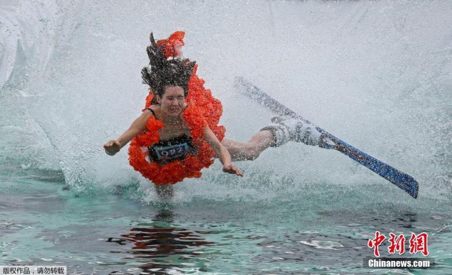 A costumed skier attempts to cross a pool of water at the foot of a ski slope during the annual Gornoluzhnik amateur event to mark the end of the ski season at the Bobrovy Log ski resort in Krasnoyarsk, Russia, April 14, 2019. (Photo/Agencies)

Skiers transition from snow to water at the annual Gornoluzhnik amateur event marking the end of the ski season at the Bobrovy Log ski resort in the suburbs of the Siberian city of Krasnoyarsk, Russia.