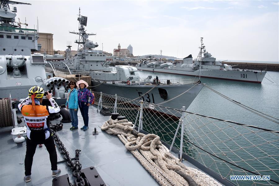 People take photos in the Chinese Navy Museum in Qingdao, east China\'s Shandong Province, April 16, 2019. (Xinhua/Li Ziheng)
