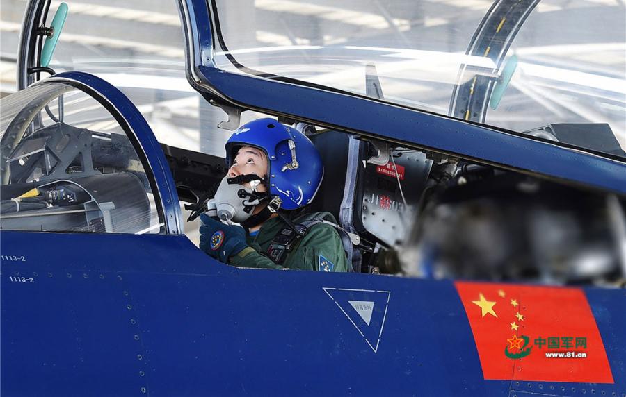 He Xiaoli, a female pilot, double-checks cockpit instruments before canopy is closed on April 10, 2019.