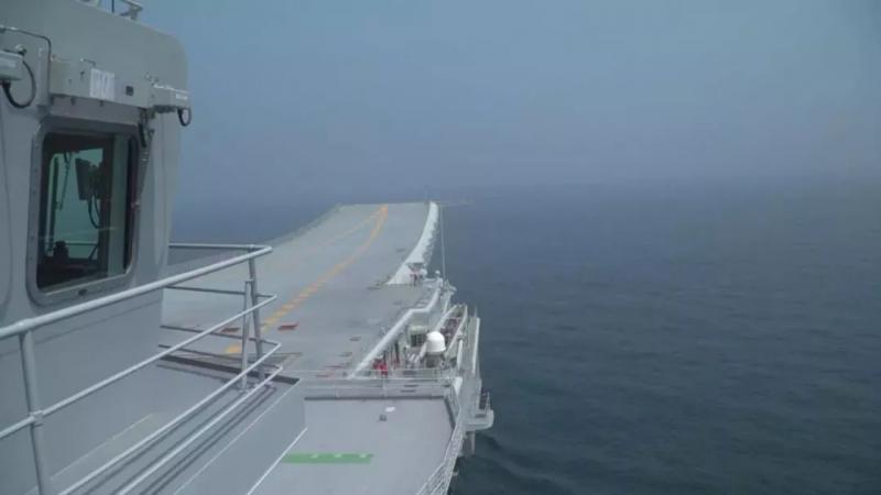 A photo of China\'s first domestically made aircraft carrier during its fifth sea trial. (Photo/CCTV)