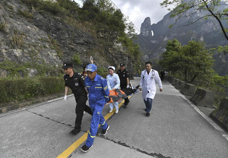 Rescue workers carry a \