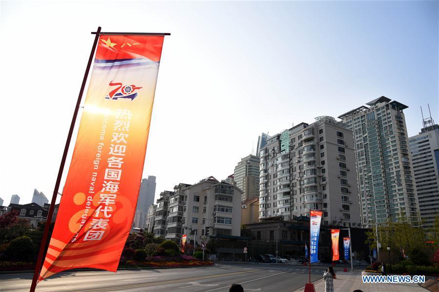 Photo taken on April 17, 2019 shows the signs celebrating the 70th founding anniversary of the People\'s Liberation Army (PLA) Navy in Macao Road of Qingdao, east China\'s Shandong Province. April 23 is the 70th founding anniversary of the PLA Navy, and a commemorative event will be held in the eastern coastal city of Qingdao. (Xinhua/Li Ziheng)