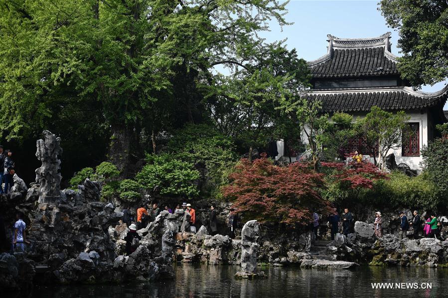 People visit the Lion Forest Garden in Suzhou, east China\'s Jiangsu Province, April 17, 2019. Suzhou is home to dozens of famous classical gardens that have inventive and exquisite design and oriental aesthetics. Nowadays more than 60 of them are still in existence, among which the Humble Administrator\'s Garden, Lingering Garden and the Lion Grove Garden are on the UNESCO\'s World Heritage List. (Xinhua/Li Xiang)