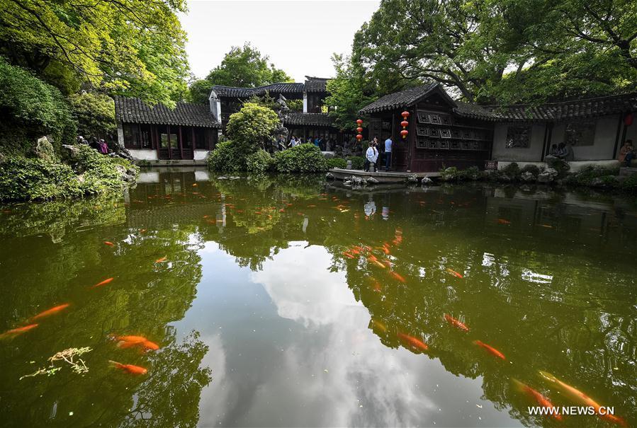 People visit the Retreat &Reflection Garden in Suzhou, east China\'s Jiangsu Province, April 19, 2019. Suzhou is home to dozens of famous classical gardens that have inventive and exquisite design and oriental aesthetics. Nowadays more than 60 of them are still in existence, among which the Humble Administrator\'s Garden, Lingering Garden and the Lion Grove Garden are on the UNESCO\'s World Heritage List. (Xinhua/Li Xiang)