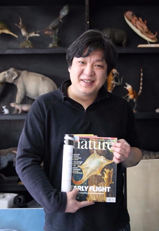 Zhao Chuang\'s drawing Restoration of Volaticotherium as the cover of the British Nature magazine. (Photo/China Daily)

He works with scientists from the American Museum of Natural History and the Chinese Academy of Sciences to provide scientific and artistic support for their research projects.

As of now, Zhao has completed work on more than 1,000 ancient fossil bio-images and the 3D biological images of hundreds of paleontological fossils based on the latest research results of the scientific community.

In addition, Zhao and writer Yang Yang are the founders of the PNSO, an organization devoted to the research and creation of scientific art in Beijing. They compile dinosaur-themed science books, design and make dinosaur model toys, and let people feel connected with the fossils.
