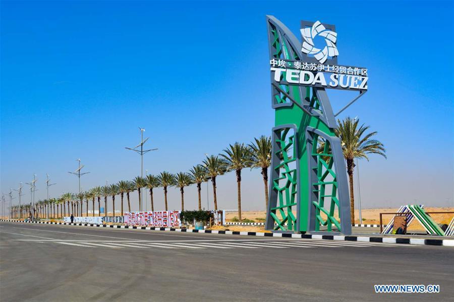 A photo taken in December 2018 shows a sign for the China-Egypt Suez Economic and Trade Cooperation Zone, located some 120 km east of Cairo near the Suez Canal. (Photo/Xinhua)

Economic and Trade Cooperation Zone

China-Egypt Suez Economic and Trade Cooperation Zone

The China-Egypt Suez Economic and Trade Cooperation Zone, located in the Ain Sokhna district of the Suez province east of Cairo, has become a landmark project for China and Egypt\'s cooperation under the Belt and Road Initiative.

The zone, officially starting construction over a decade ago, is operated by China-Africa TEDA Investment Co Ltd. It has attracted nearly 80 enterprises with investment of more than $1 billion, directly offered jobs to over 3,500 people and created 30,000 job opportunities through the industries gathered there.

In January 2016 the second phase of the zone, which covers an area of 6 square kilometers, was inaugurated. As of February infrastructure construction for 2 square km of the second phase has finished, and that eight industry-leading enterprises are already onboard with an investment of $200 million.
