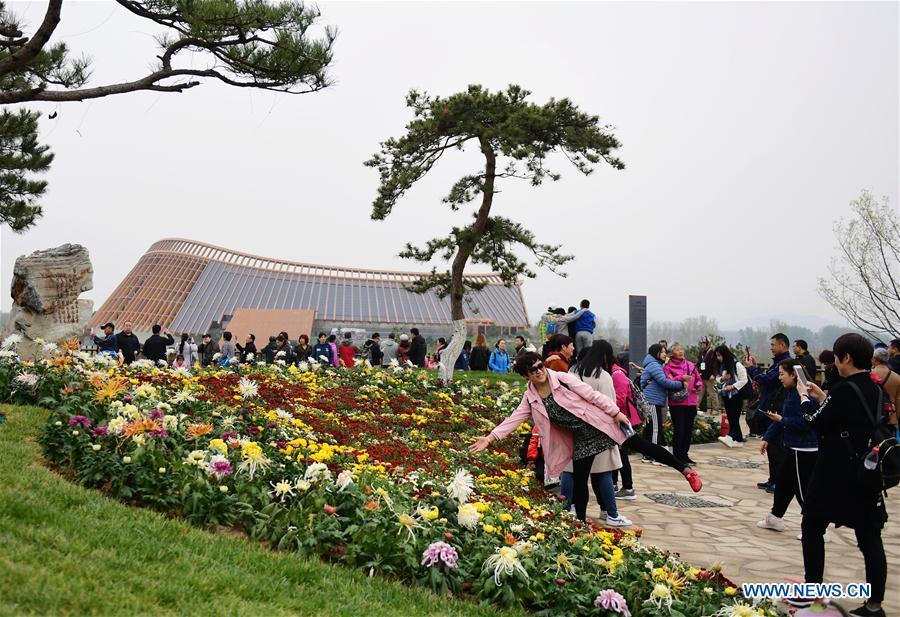 Visitors tour the site of the 2019 Beijing International Horticultural Exhibition (Expo 2019 Beijing) during a trial run in Yanqing District of Beijing, capital of China, April 20, 2019. Beijing on Saturday held a trial opening of the site for the upcoming 2019 Beijing International Horticultural Exhibition to test the reception capacity of the event. About 60,000 people visited the 503-hectare expo site Saturday. (Xinhua/Zhang Chenlin)