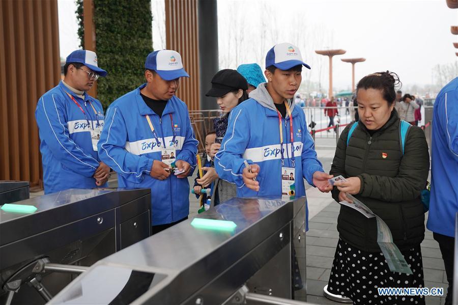 Visitors have their tickets checked at the entrance of the 2019 Beijing International Horticultural Exhibition (Expo 2019 Beijing) during a trial run in Yanqing District of Beijing, capital of China, April 20, 2019. Beijing on Saturday held a trial opening of the site for the upcoming 2019 Beijing International Horticultural Exhibition to test the reception capacity of the event. About 60,000 people visited the 503-hectare expo site Saturday. (Xinhua/Ju Huanzong)
