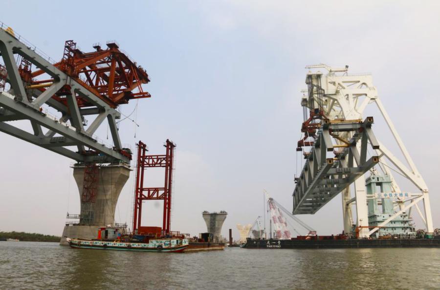 Construction of the core part of the Padma Bridge over the Padma River in Bangladesh is underway by China Railway Major Bridge 
Engineering Group Co Ltd on Feb. 21, 2019. (Photo/Xinhua)

Padma Bridge, Bangladesh

The Padma Bridge, 25 meters in width and 10 km in length, will be built over the Padma River, one of the three major rivers in Bangladesh.

In June 2016, China Railway Major Bridge Engineering Group Co Ltd was awarded a $1.55-billion contract by the Bangladeshi government to build the core structure of the bridge.

The bridge is the country\'s largest infrastructure project, as well as the largest foreign bridge project undertaken by Chinese companies in terms of total cost.

Once completed, travel time between the capital, Dhaka, and the southern city of Khulna will be shortened to about three hours from 13 hours.