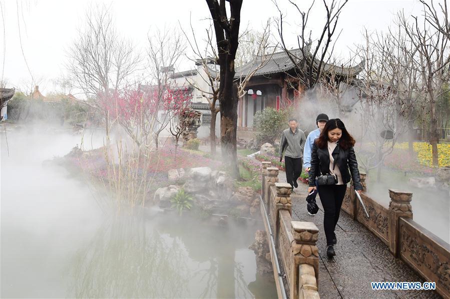 Visitors tour the Anhui Garden of the 2019 Beijing International Horticultural Exhibition (Expo 2019 Beijing) during a trial run in Yanqing District of Beijing, capital of China, April 20, 2019. Beijing on Saturday held a trial opening of the site for the upcoming 2019 Beijing International Horticultural Exhibition to test the reception capacity of the event. About 60,000 people visited the 503-hectare expo site Saturday. (Xinhua/Zhang Chenlin)