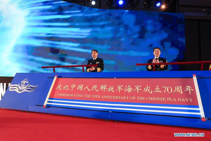 Commander of the Chinese People\'s Liberation Army (PLA) Navy Shen Jinlong (L) and Political Commissar of the PLA Navy Qin Shengxiang attend the opening ceremony of the multinational naval events commemorating the 70th founding anniversary of the PLA Navy in Qingdao, east China\'s Shandong Province, April 22, 2019. (Xinhua/Ju Zhenhua)