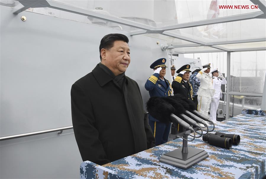 Chinese President Xi Jinping, also general secretary of the Communist Party of China Central Committee and chairman of the Central Military Commission, reviews a multinational fleet during a naval parade held in Qingdao, east China\'s Shandong Province, on April 23, 2019. A naval parade was staged here to mark the 70th founding anniversary of the Chinese People\'s Liberation Army Navy on Tuesday. (Xinhua/Li Gang)
