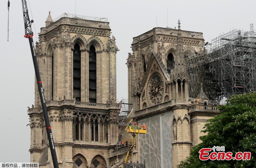 Protective material has been wrapped around parts of Notre Dame, April 23, 2019. Architects working on preserving Notre-Dame are rushing to cover the cathedral before rain can cause further damage. (Photo/Agencies)