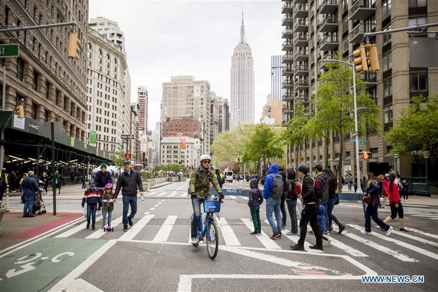 Pedestrians and a cyclist move down Broadway during the Car Free Earth Day 2019 in New York, the United States, April 27, 2019. The annual event was created to help raise awareness about environmentally friendly ways to get around town. (Xinhua/Michael Nagle)