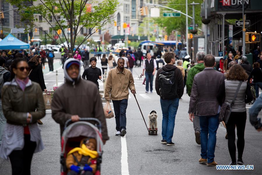People walk on Broadway during the Car Free Earth Day 2019 in New York, the United States, April 27, 2019. The annual event was created to help raise awareness about environmentally friendly ways to get around town. (Xinhua/Michael Nagle)