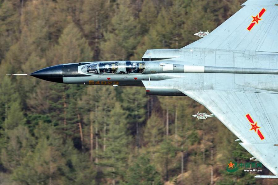 A PLA Air Force warplane in an ultra-low altitude flight training in a valley, April 25, 2019. (Photo/81.cn)