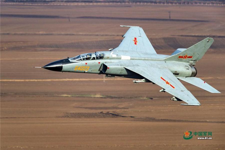 A PLA Air Force warplane in an ultra-low altitude flight training in a valley, April 25, 2019. (Photo/81.cn)