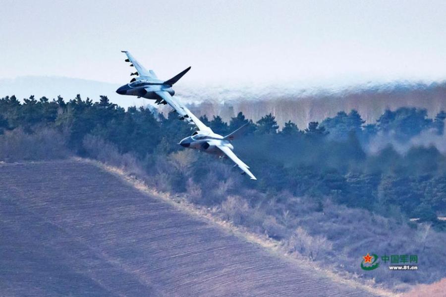A PLA Air Force warplane in an ultra-low altitude flight training in a valley, April 25, 2019. (Photo/81.cn)
