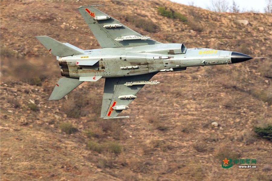 A PLA Air Force warplane in an ultra-low altitude flight training in a valley, April 25, 2019. (Photo/81.cn)