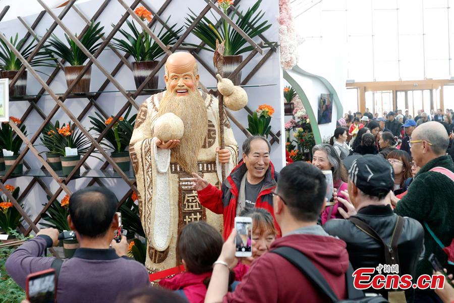 People visit the China Pavilion during the 2019 Beijing International Horticultural Exhibition in Yanqing District of Beijing, China, April 29, 2019. At the center of the expo site stands the Chinese Pavilion, a curved exhibition hall in the shape of a \