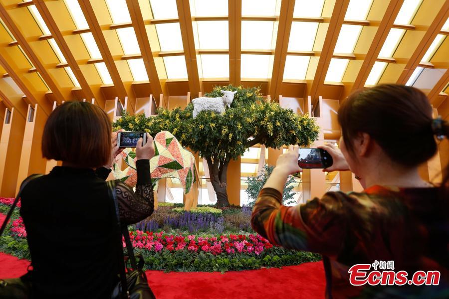 People visit the China Pavilion during the 2019 Beijing International Horticultural Exhibition in Yanqing District of Beijing, China, April 29, 2019. At the center of the expo site stands the Chinese Pavilion, a curved exhibition hall in the shape of a \