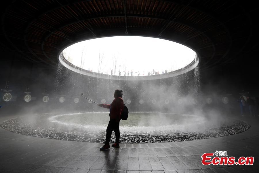 People visit the China Pavilion during the 2019 Beijing International Horticultural Exhibition in Yanqing District of Beijing, China, April 29, 2019. At the center of the expo site stands the Chinese Pavilion, a curved exhibition hall in the shape of a \
