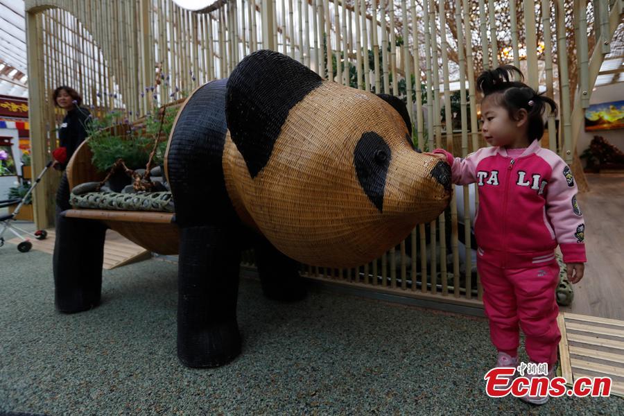 People visit the China Pavilion during the 2019 Beijing International Horticultural Exhibition in Yanqing District of Beijing, China, April 29, 2019. At the center of the expo site stands the Chinese Pavilion, a curved exhibition hall in the shape of a \