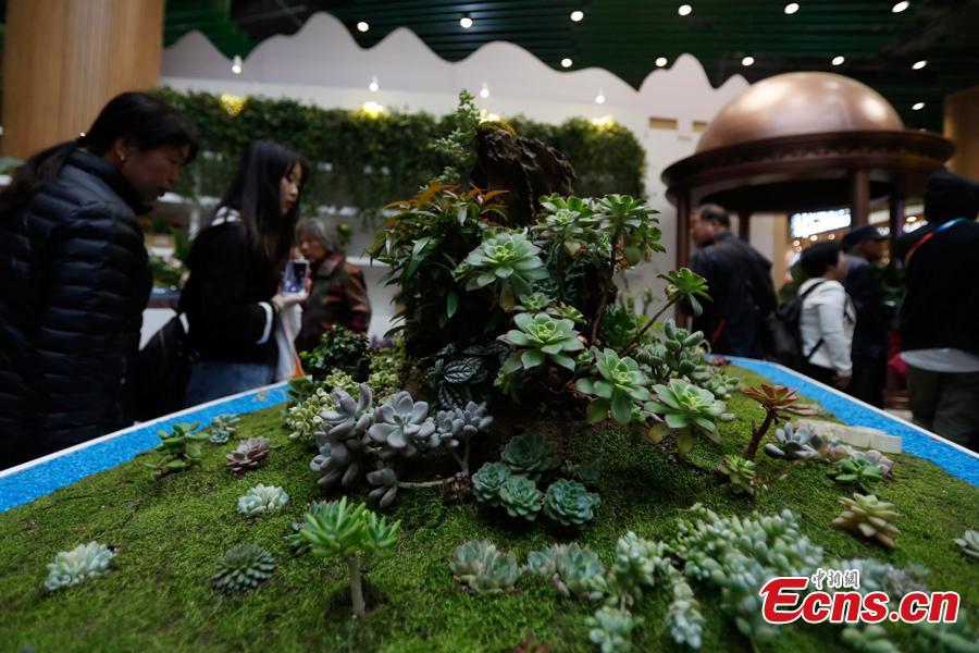 People visit the China Pavilion during the 2019 Beijing International Horticultural Exhibition in Yanqing District of Beijing, China, April 29, 2019. At the center of the expo site stands the Chinese Pavilion, a curved exhibition hall in the shape of a \