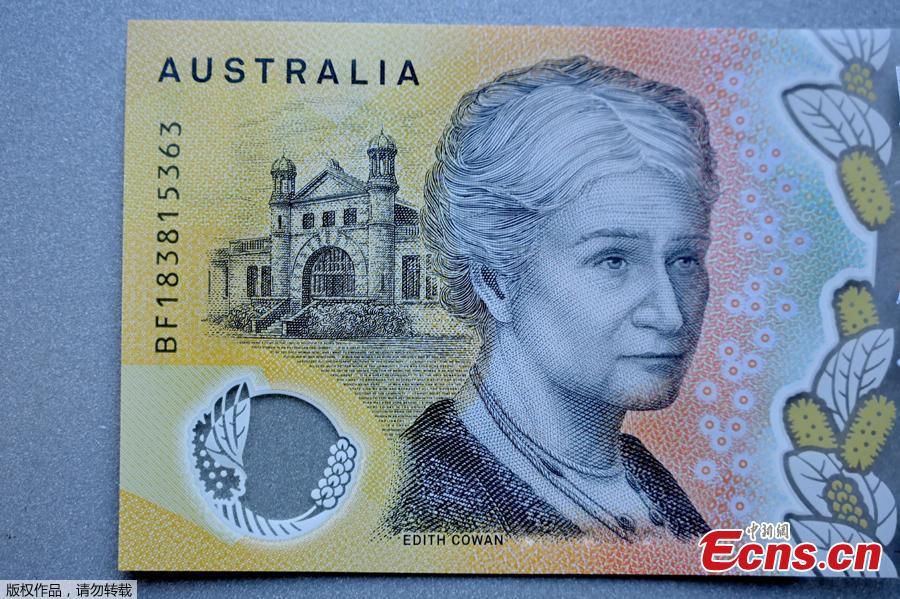 This photo illustration shows the detail in Australia\'s state-of-the-art new 50 dollar banknote in Sydney on May 9, 2019, with a spelling mistake in the microprint of a speech by Australia\'s first woman parliamentarian Edith Cowan. The yellow and green note came into circulation last October, but it took seven months for the public to notice \