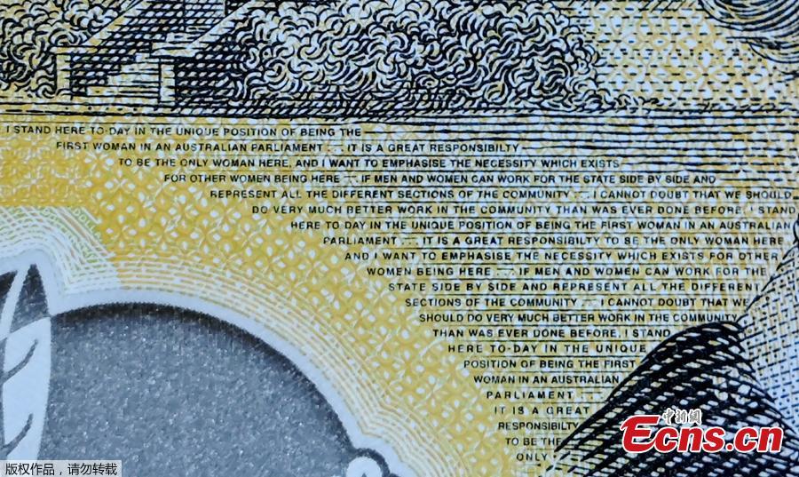 This photo illustration shows the detail in Australia\'s state-of-the-art new 50 dollar banknote in Sydney on May 9, 2019, with a spelling mistake in the microprint of a speech by Australia\'s first woman parliamentarian Edith Cowan. The yellow and green note came into circulation last October, but it took seven months for the public to notice \