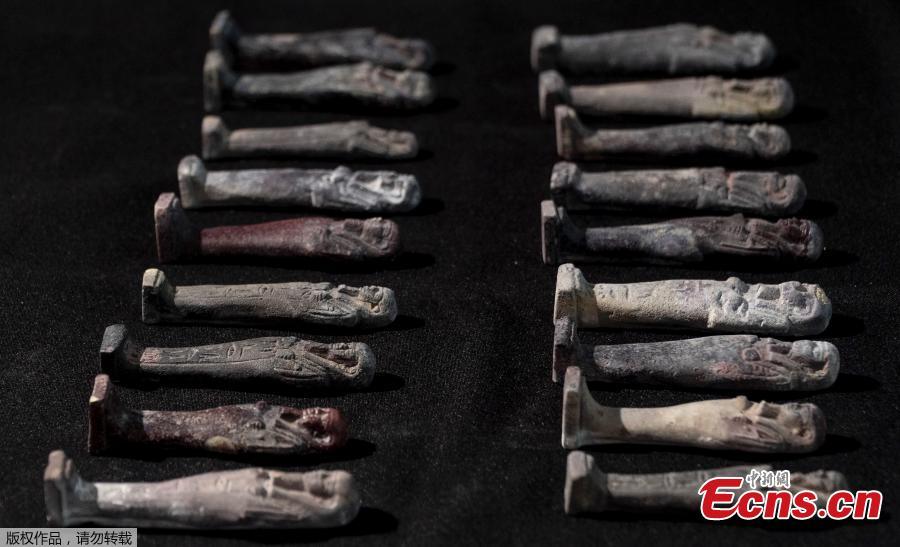 Recovered Shabits, mummy-liked statues, are presented to the media by the National Museum during a news conference in Rio de Janeiro, Brazil, Tuesday, May 7, 2019. Brazil\'s national museum said Tuesday it has recovered 200 pieces from its 700 pieces Egypt collection, the largest in Latin America, after a devastating fire in September 2018. (Photo/Agencies)