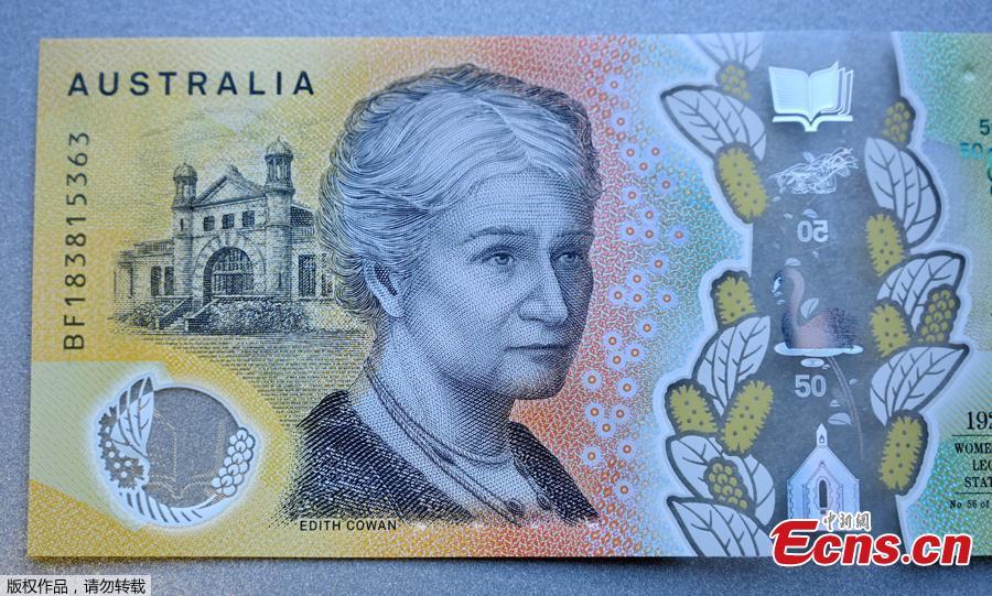 This photo illustration shows the detail in Australia\'s state-of-the-art new 50 dollar banknote in Sydney on May 9, 2019, with a spelling mistake in the microprint of a speech by Australia\'s first woman parliamentarian Edith Cowan. The yellow and green note came into circulation last October, but it took seven months for the public to notice \