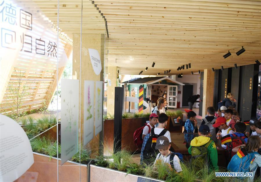 Visitors are seen on the Germany Day of Beijing International Horticultural Exhibition in Beijing, capital of China, on May 13, 2019. The expo welcomes Germany Day on Monday. With a theme of \