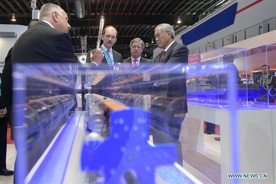 Singapore Defense Minister Ng Eng Hen (1st R) is seen at the 12th International Maritime Defense Exhibition and Conference (IMDEX Asia) held in Singapore\'s Changi Exhibition Centre on May 14, 2019. Singapore Defense Minister Ng Eng Hen welcomed here Tuesday foreign navies attending the 12th International Maritime Defense Exhibition and Conference (IMDEX Asia) at its opening ceremony. A total of 23 warships from 15 countries sailed their way to IMDEX Asia at the Changi Naval Base, together with 26 chiefs of defense forces and navies, vice chiefs, directors-general of coast guards and senior naval officers. (Xinhua/Then Chih Wey)