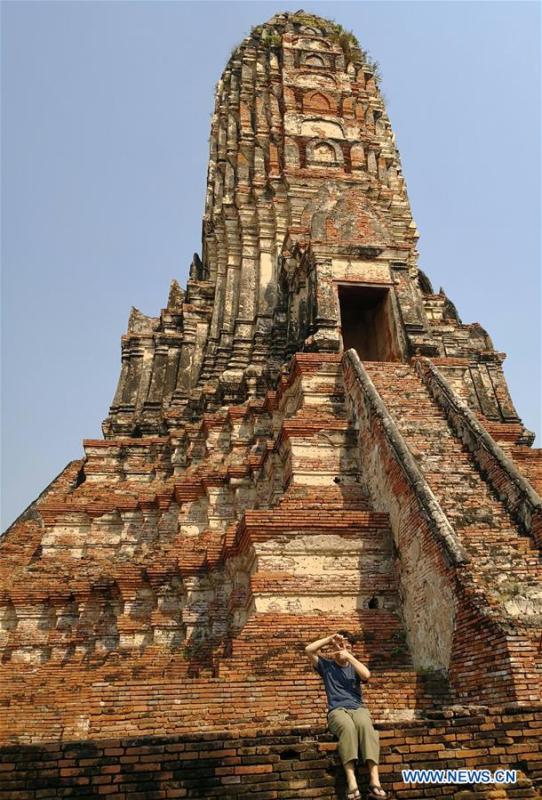 Photo taken on Feb. 6, 2018 shows Ratjirot Aekkawat visiting the historical site of Ayutthaya Dynasty in Thailand. Ratjirot Aekkawat is of mixed blood from China and Thailand. He came to study in China as a junior student and now he is a postgraduate student of the Peking University. He always talks about his experience in China with relatives and friends. He has witnessed the development of China in recent years, during which the environment and local governments\' working efficiencies have been greatly improved. Chinese and Thai cultures are influenced with each other. Many Thai people celebrate the Spring Festival every year and lots of Chinese go to Thailand for tourism. The photo of the historical site of Ayutthaya Dynasty taken by Ratjirot Aekkawat will be displayed in a photographic exhibition \