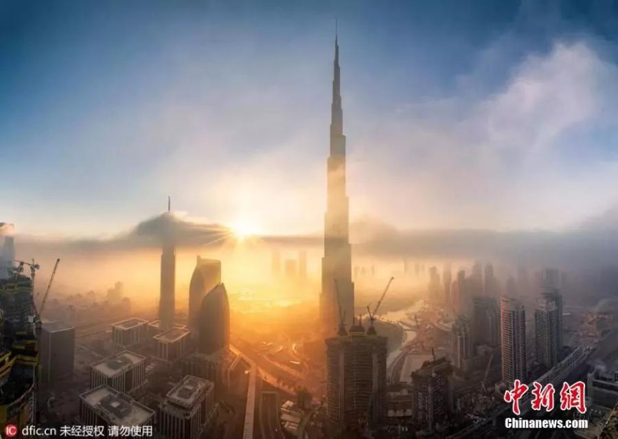 File photo shows the Burj Khalifa, the tallest tower in the world, in downtown Dubai. The Burj Khalifa stands at 829.8 meters, making it the largest building in the world.  (Photo/IC)
