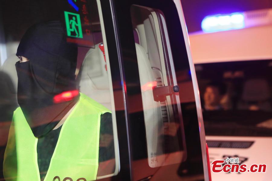 Police escort suspects caught in a social network and telecommunication fraud bust as they arrive at Pudong International Airport in Shanghai, May 14, 2019. Police detained the 57 suspects in Danzhou City of South China’s Hainan Province and then transported them to Shanghai as investigations continue.  (Photo: China News Service/Yin Liqin)