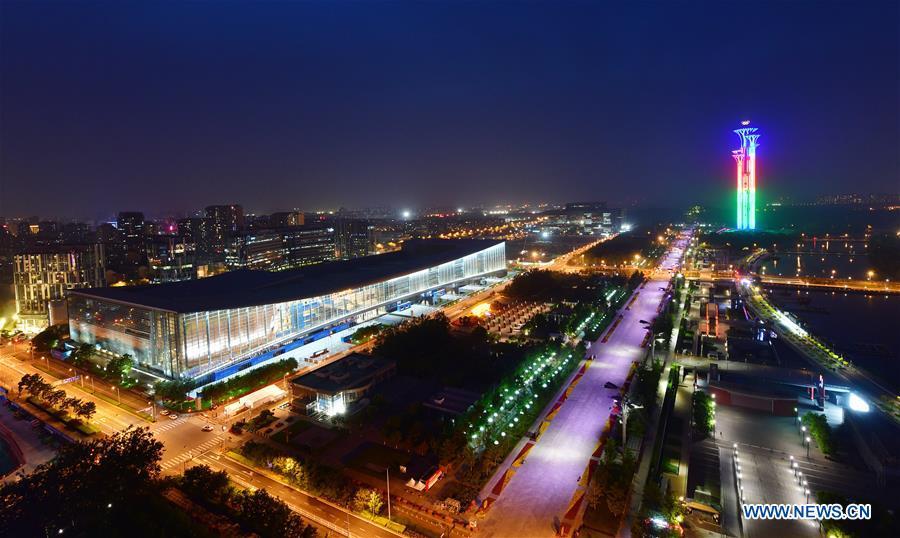 Photo taken on May 14, 2019 shows the night view of the China National Convention Center and the Olympic Tower in Beijing, capital of China. Roads and buildings were illuminated Tuesday evening before the upcoming Conference on Dialogue of Asian Civilizations (CDAC) in Beijing. (Xinhua/Li He)