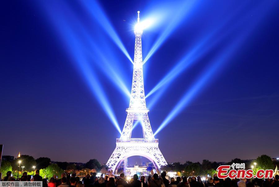 The Eiffel tower is illuminated during a light show to celebrate its 130th anniversary in Paris, France, May, 15, 2019. (Photo/Agencies)
