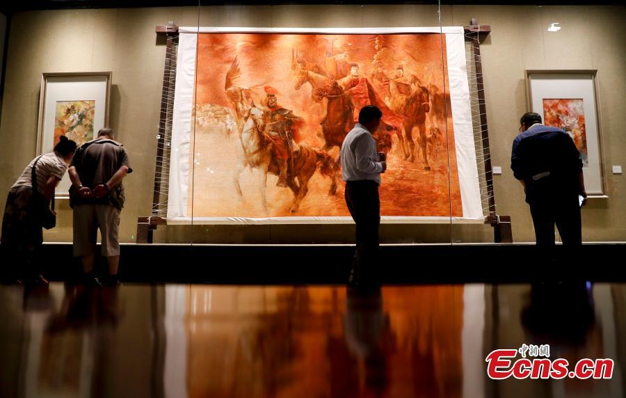 Photo taken on May 16, 2019 shows an exhibition of intangible cultural heritages from Asia at the National Library of China in Beijing as part of the ongoing Conference on Dialogue of Asian Civilizations. More than 60 craftsmen from 13 Asian countries and regions are displaying traditional works such as puppets from Sri Lanka, Persian carpets from Iran and costumes from the Philippines. (Photo: China News Service/Du Yang)