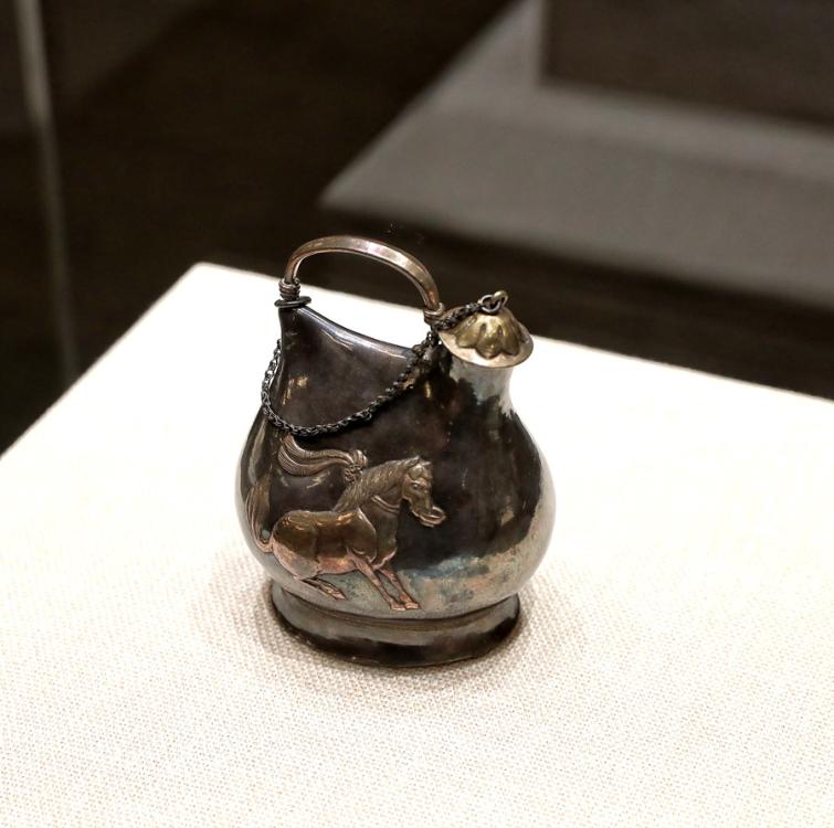 Tang Dynasty (618-907) silver pot in the shape of a leather bag, which reflects communication and the combination of Han culture and nomadic traditions, Shaanxi History Museum. (Photo provided to China Daily) 

Events provide opportunity to bolster understanding among nations

In 1409, before Chinese admiral Zheng He led his large fleet to distant shores, he asked artisans to make a carved-stone stele in Nanjing, Jiangsu province.

The stele traveled with the flotilla and was left in Sri Lanka as a gift to a local Buddhist temple. Praises for deities in three languages-Chinese, Persian and Tamil-were carved on the stele.

Friendship via the ancient maritime Silk Road was strengthened when the stele was found in 1911 in the southwestern Sri Lankan city of Galle. A replica of the artifact is now in China.

President Xi Jinping, foreign leaders and other dignitaries attending the opening ceremony of the Conference on Dialogue of Asian Civilizations visited an exhibition of cultural relics, which displayed artifacts including the stele, at the China National Convention Center in Beijing on Wednesday.