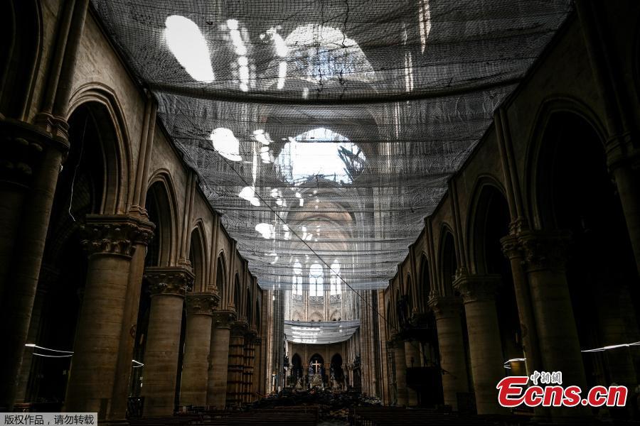 A picture shows a protective net inside the Notre Dame de Paris Cathedral, Wednesday May 15, 2019 in Paris. French Culture Minister Franck Riester says that one month after a fire engulfed Notre Dame Cathedral, the edifice is still being made safe enough for restoration to begin. (Photo/Agencies)